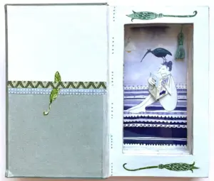Tamar Rubinstein, Lezende vrouw in boek 8, 185 euro, Mixed media/collage in old book, 19x22x3 cm