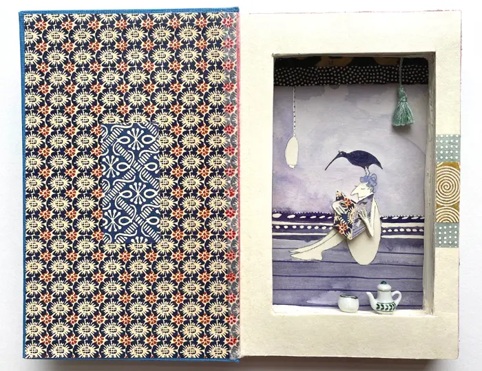 Tamar Rubinstein, Lezende vrouw in boek, 185 euro, Mixed media in vintage book, 22x27x4 cm