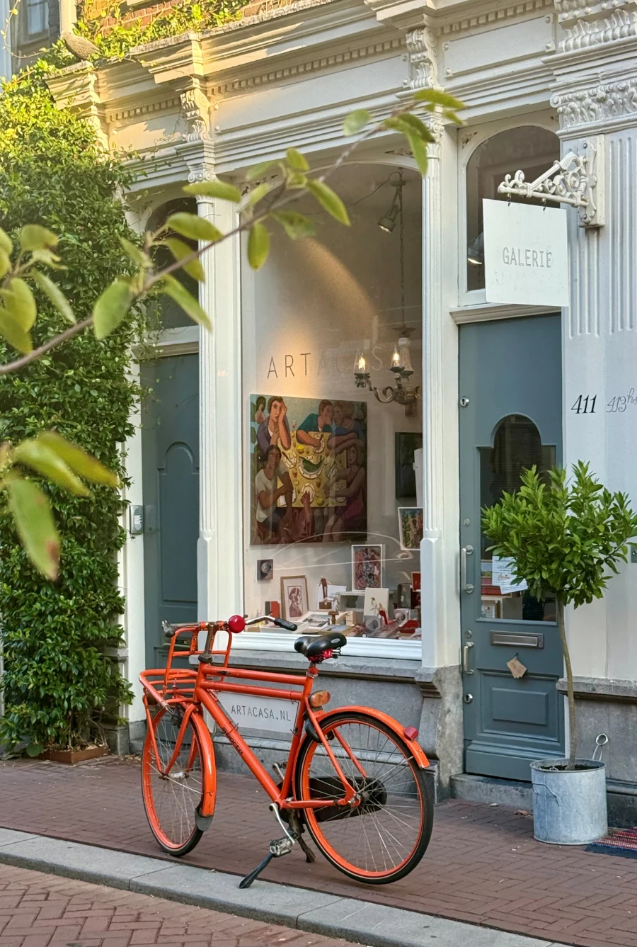 Galerie ARTACASA, Kerkstraat 411 Amsterdam, with the orange bicycle