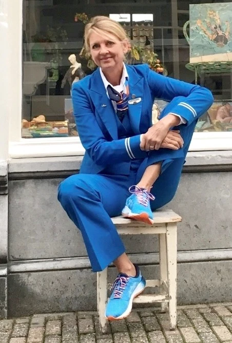 Wiebke in her KLM uniform in front of the gallery window
